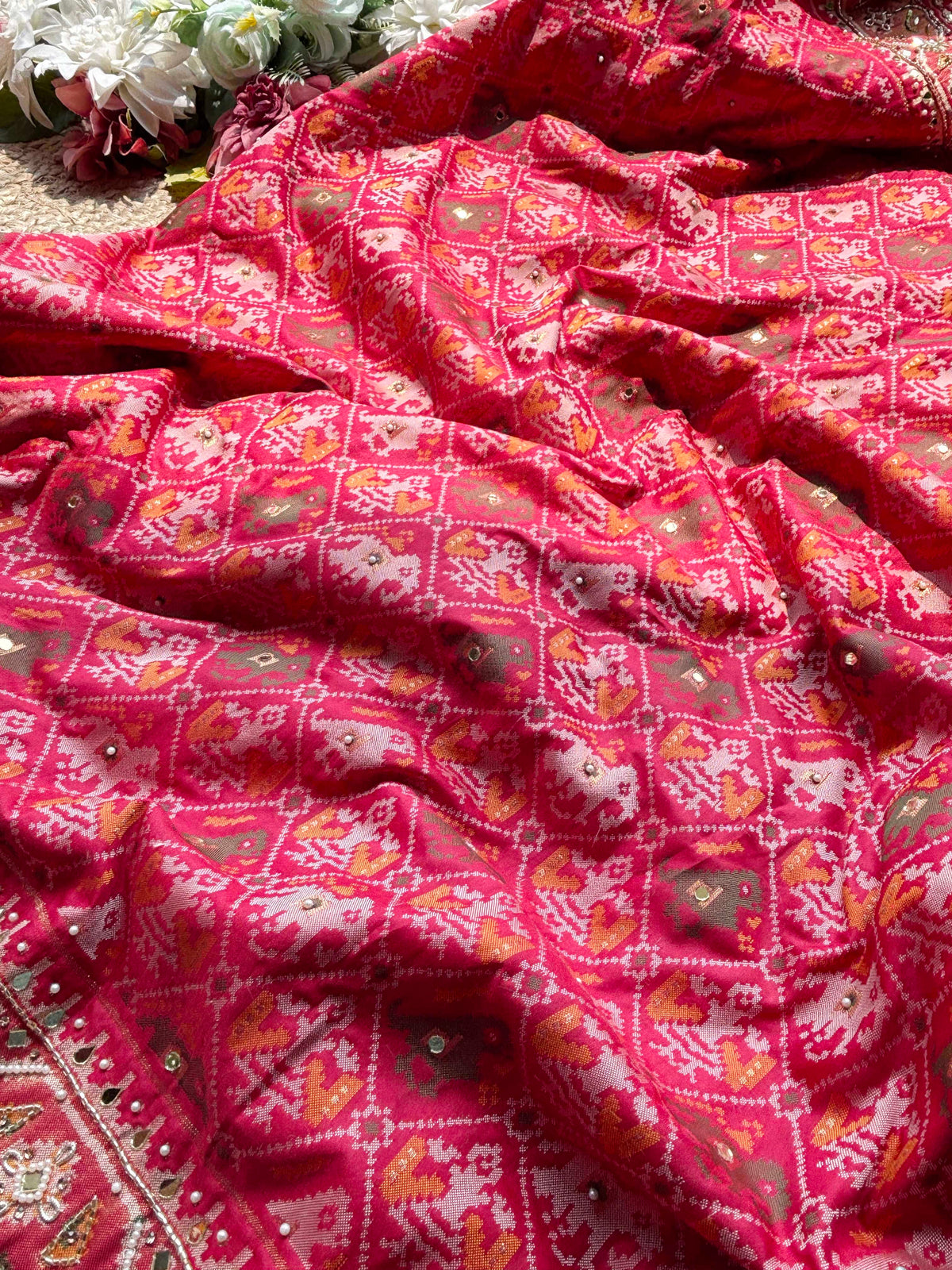 Rani Pink Patola Saree with Elephant Motifs & Embellished Border