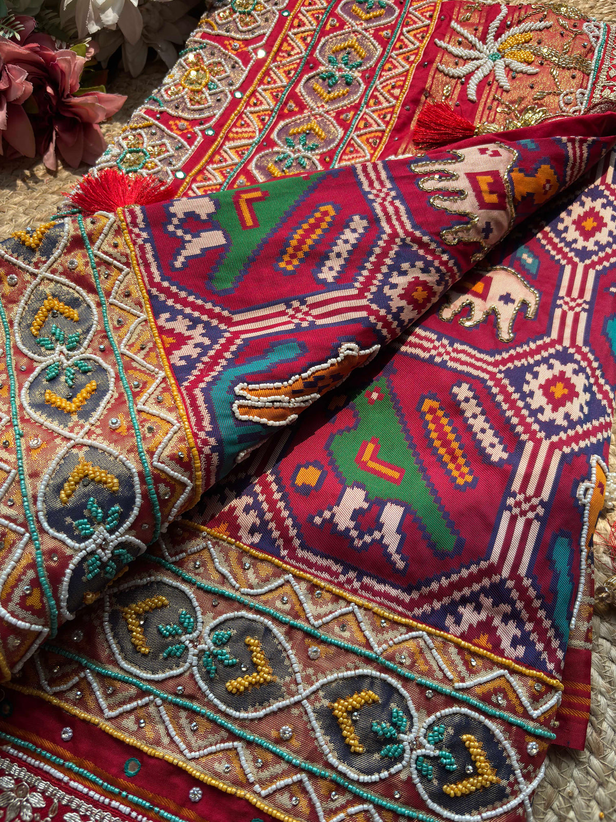 Red Patola Embellished Saree with Beadwork & Bird Motif Border
