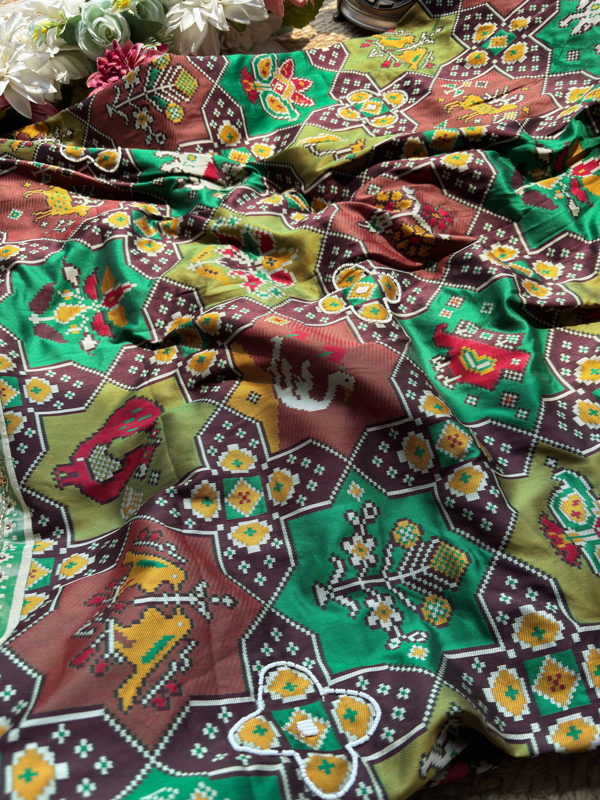 Green Patola Saree with Animal Motifs & Embellished Border
