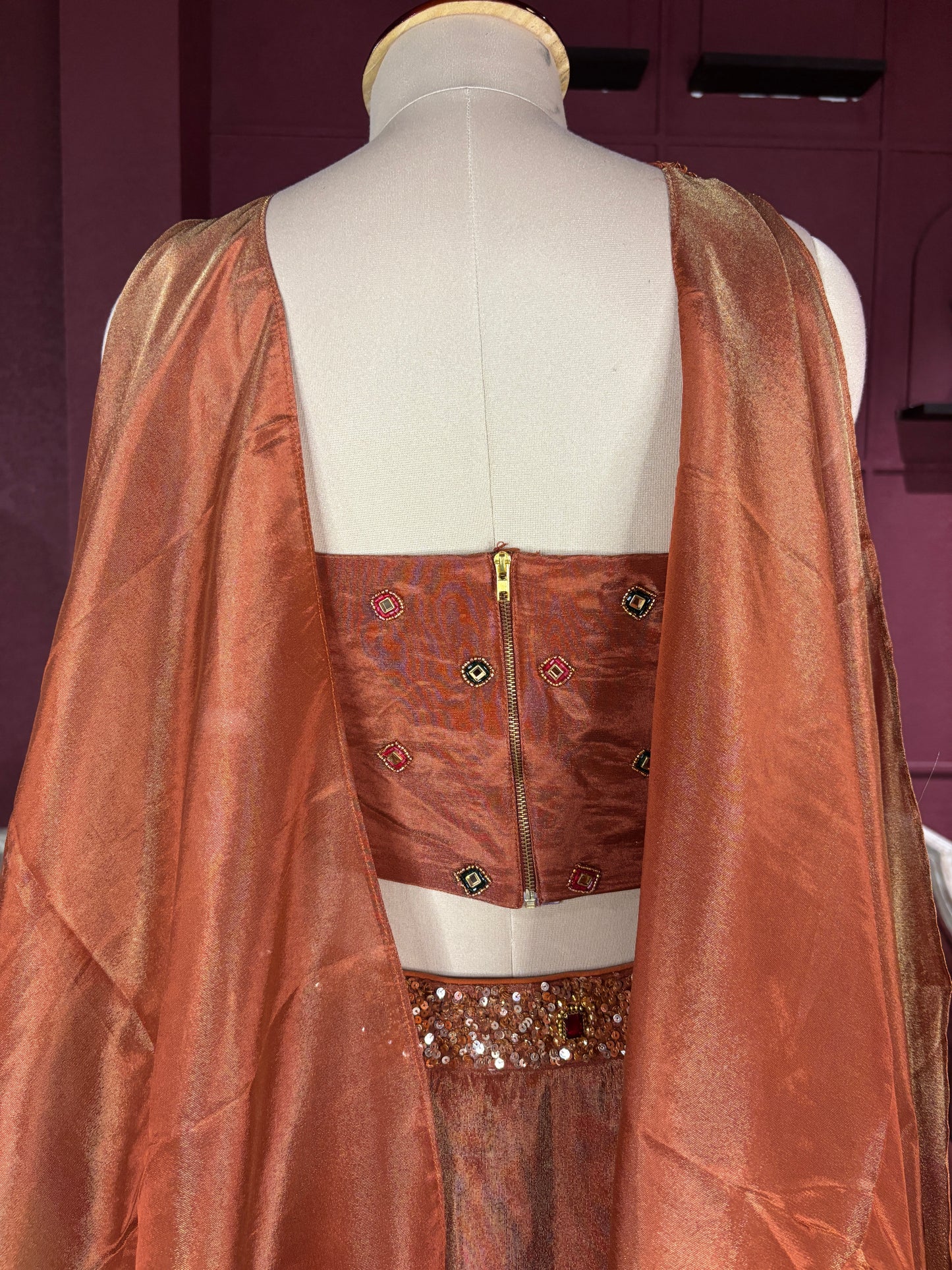Designer Bronze Lehenga with Multicolor Embellished Blouse