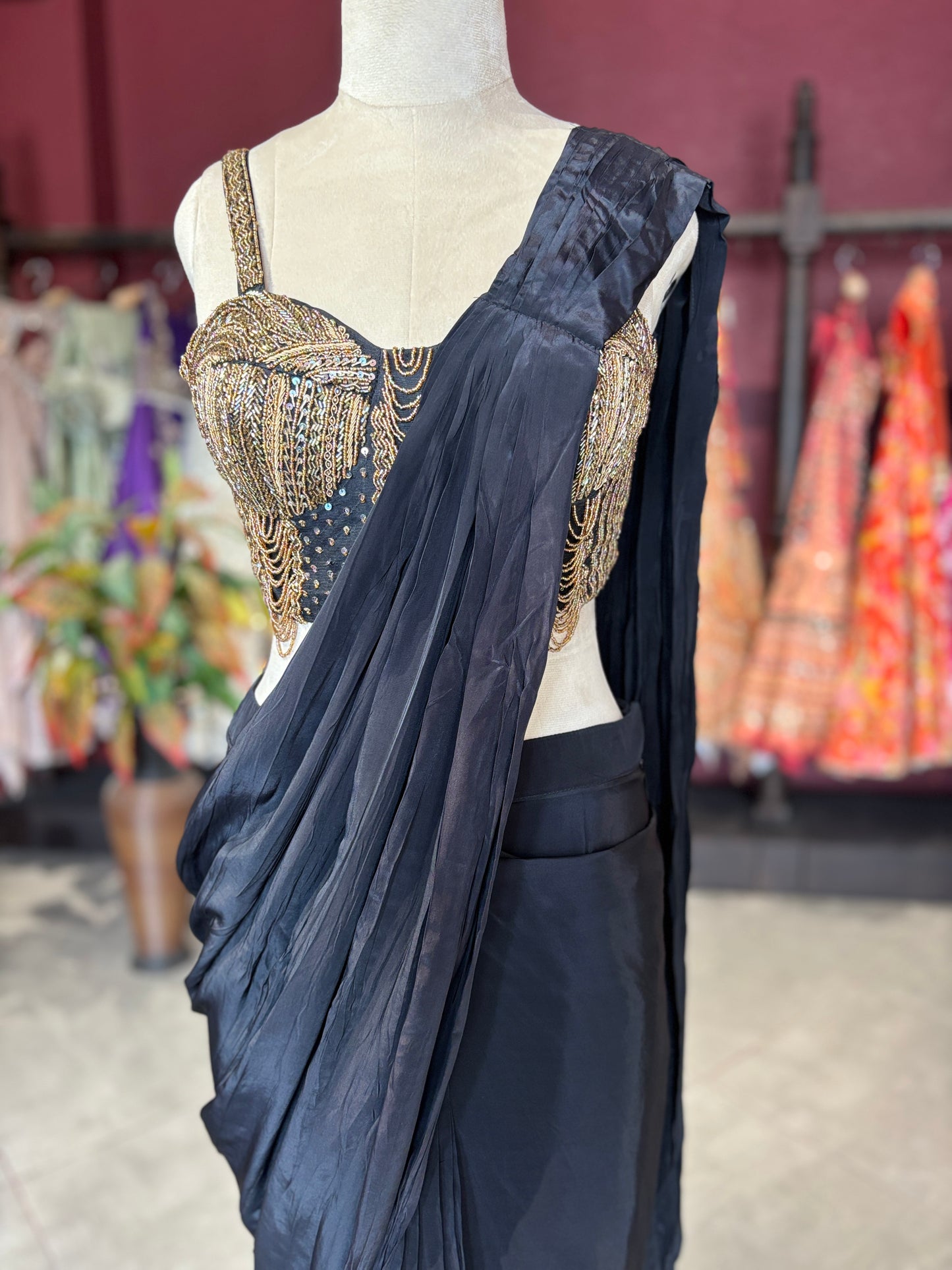 Black Designer Saree with Gold Embellished Blouse & Modern Draped Look
