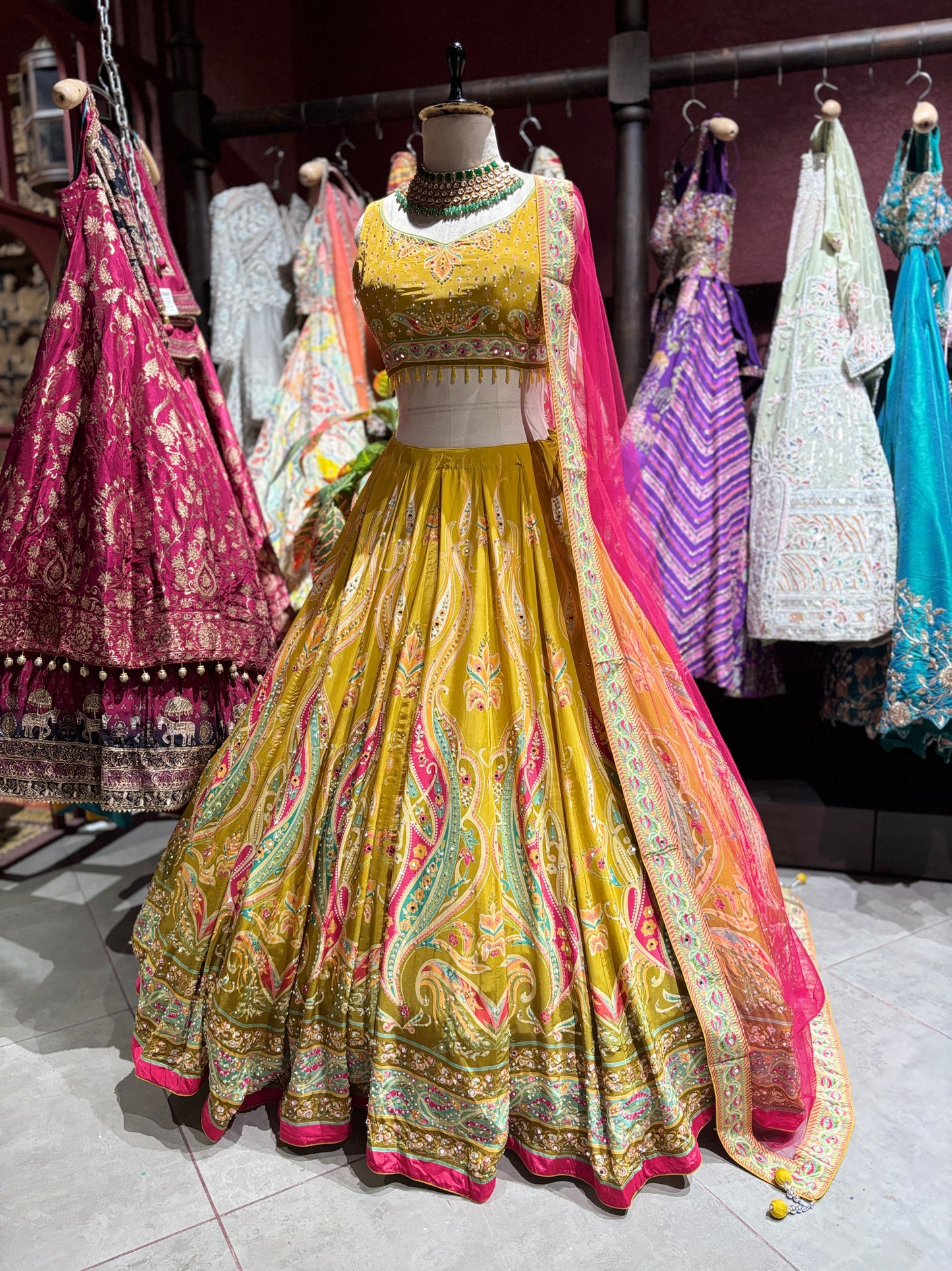 Mustard Yellow Paisley Embellished Lehenga Choli with Pink Dupatta