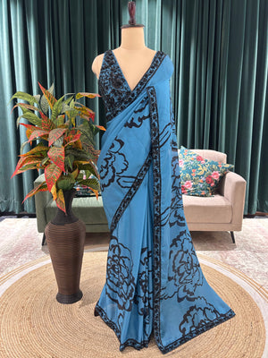 Blue Floral Print Saree with Black Embroidered Border Design