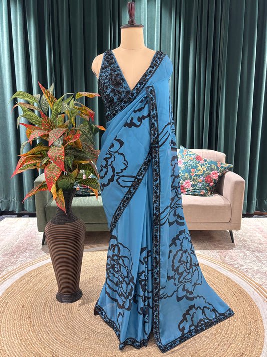 Blue Floral Print Saree with Black Embroidered Border Design