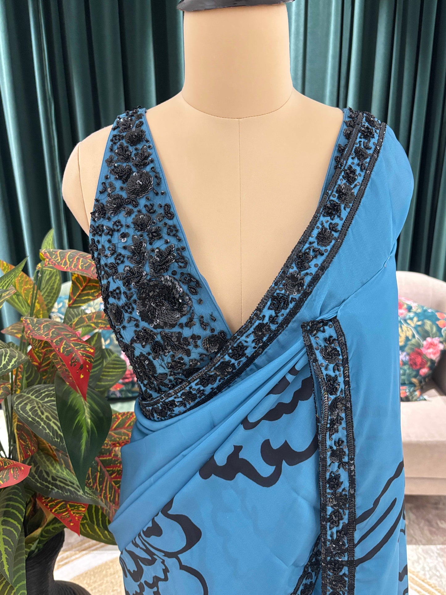 Blue Floral Print Saree with Black Embroidered Border Design