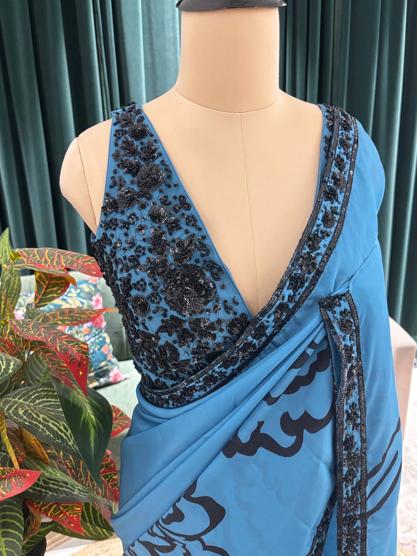 Blue Floral Print Saree with Black Embroidered Border Design