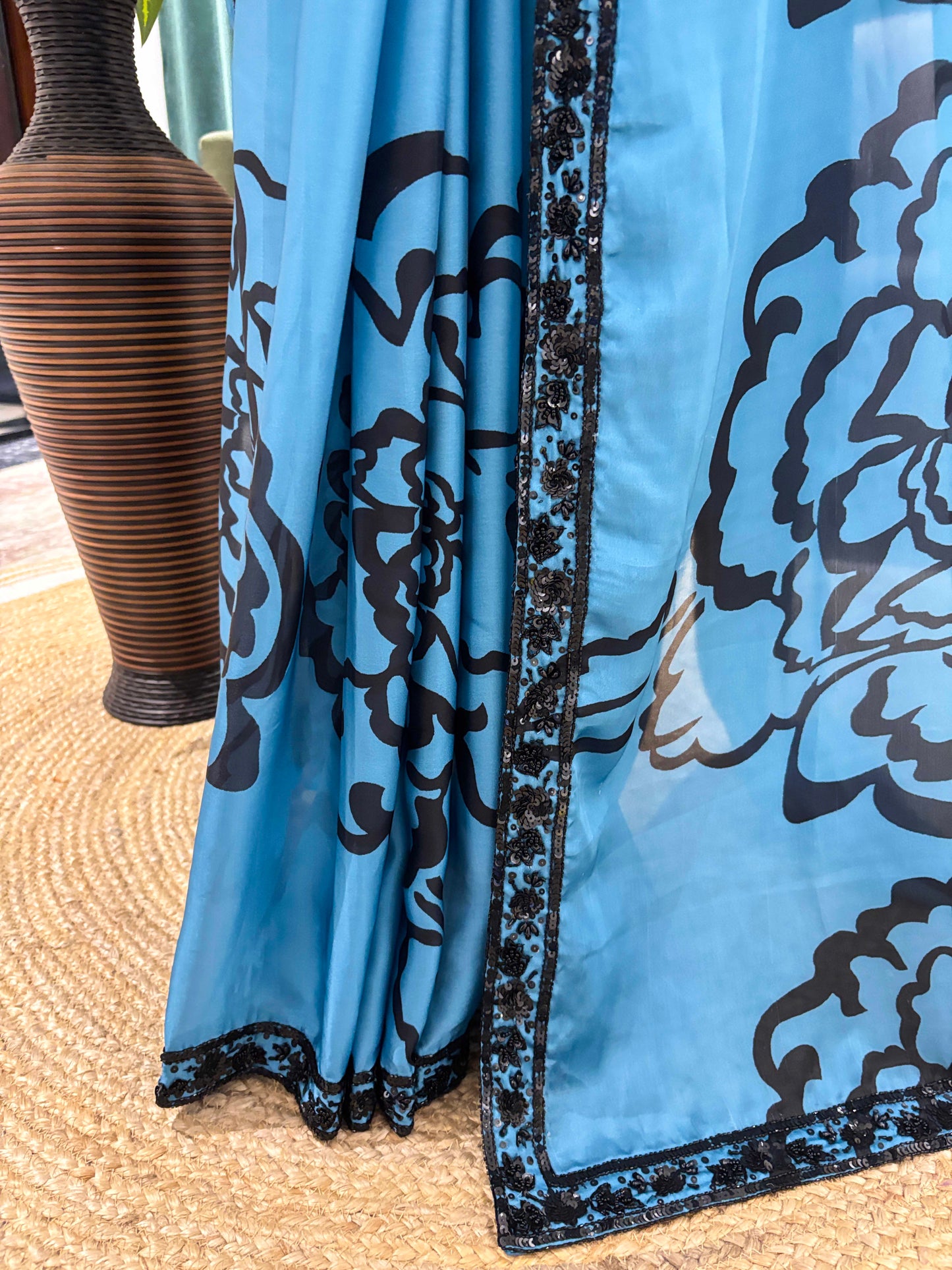 Blue Floral Print Saree with Black Embroidered Border Design
