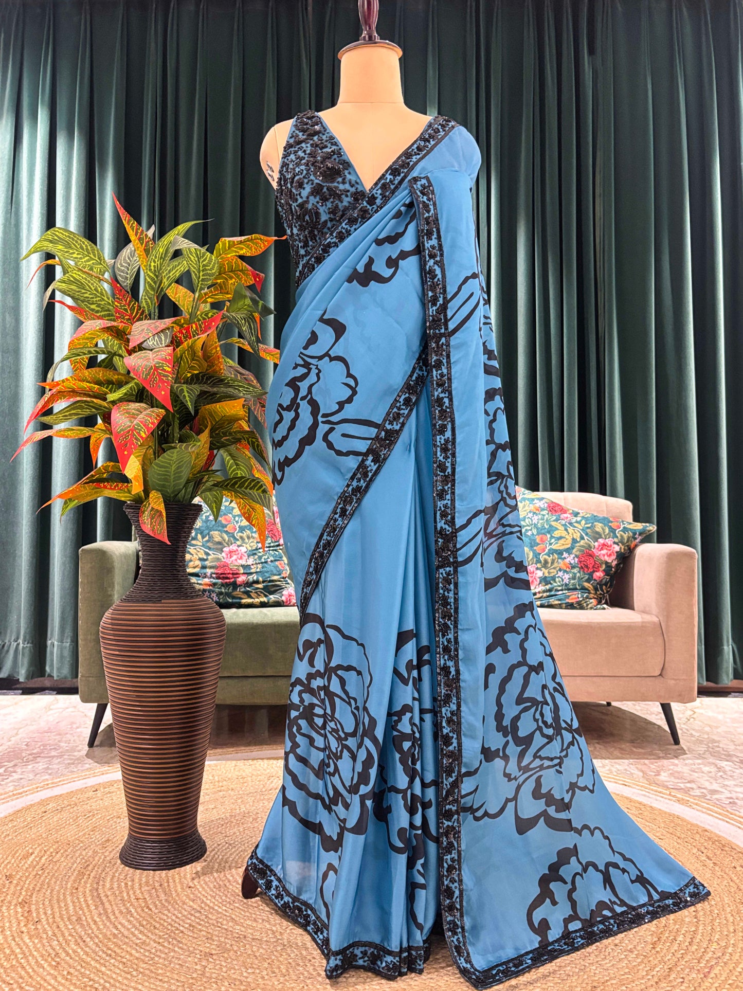 Blue Floral Print Saree with Black Embroidered Border Design
