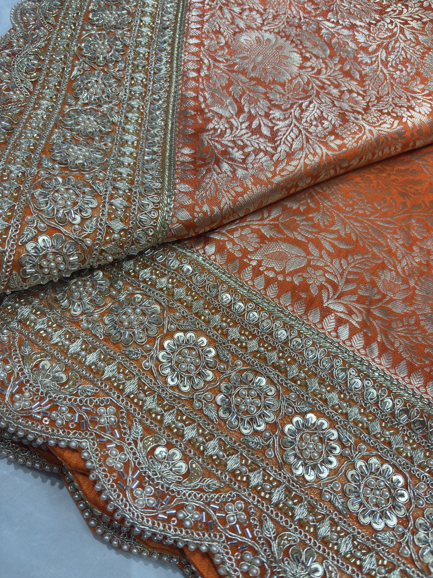Luxury Orange Saree with Floral Weaving & Pearl Embroidered Border