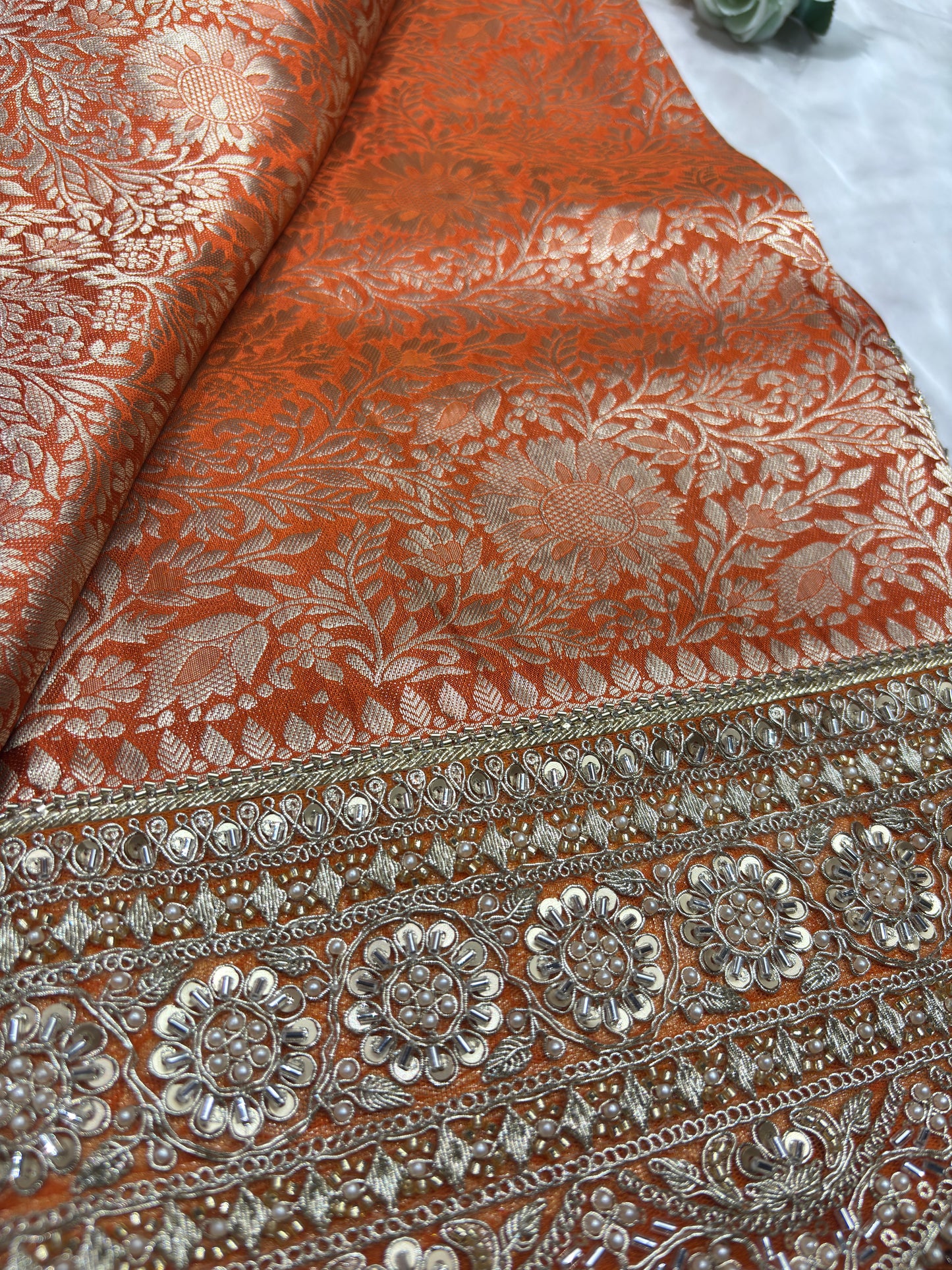 Luxury Orange Saree with Floral Weaving & Pearl Embroidered Border