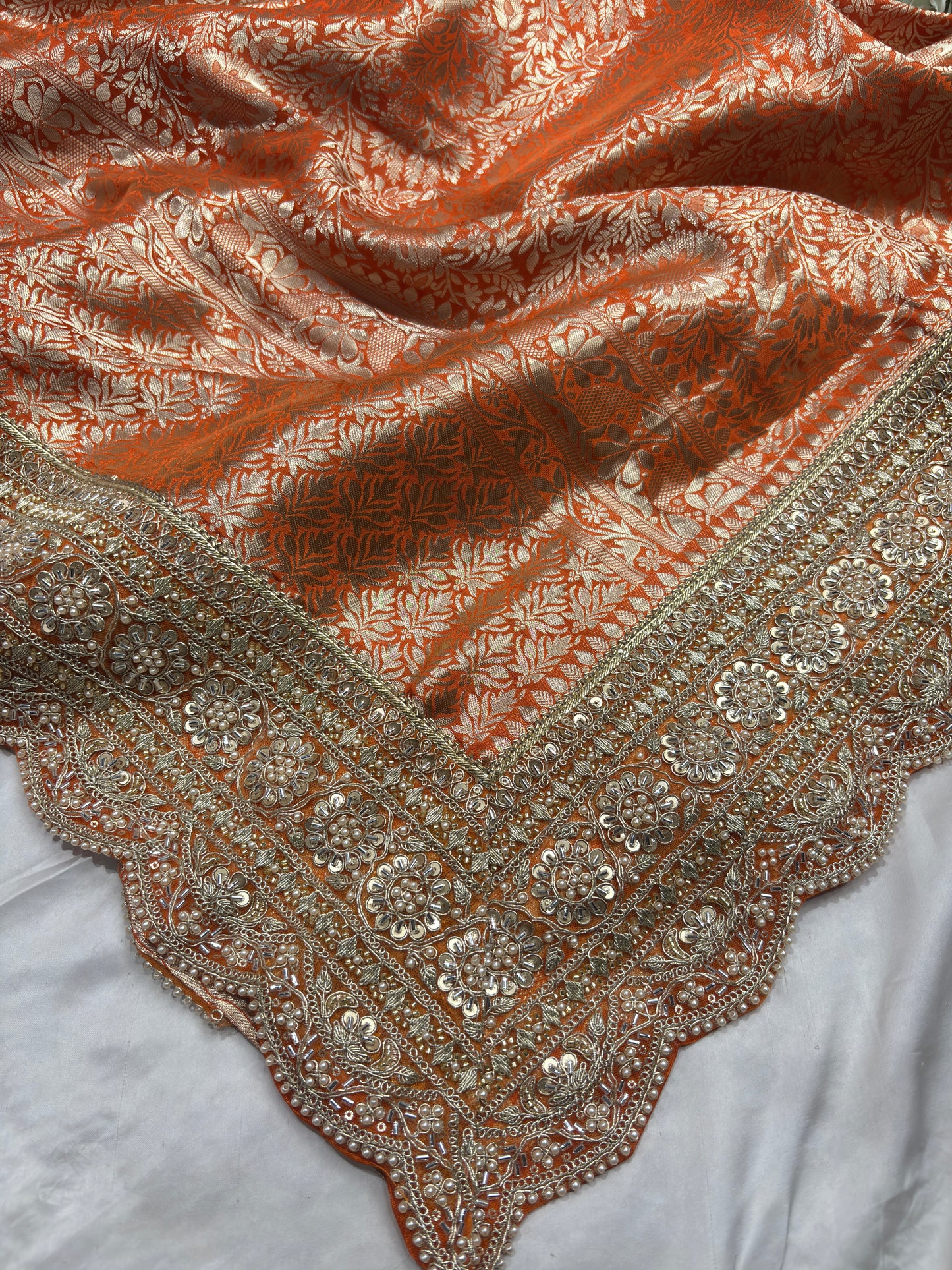 Luxury Orange Saree with Floral Weaving & Pearl Embroidered Border