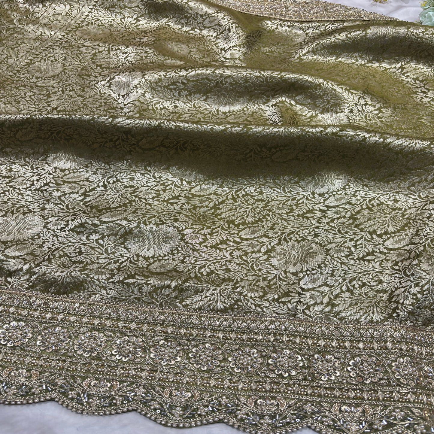 Luxury Green Saree with Floral Weaving & Pearl Embroidered Border