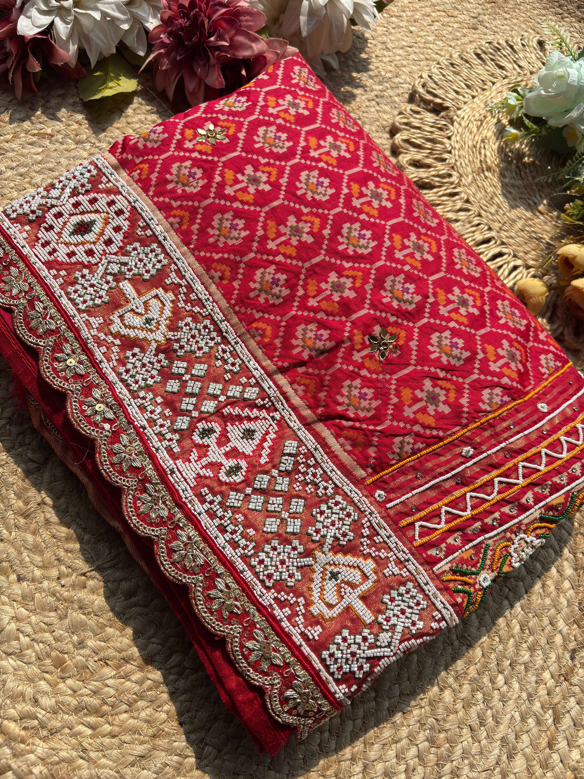 Royal Red Patola-Inspired Designer Saree with Intricate Beadwork, Traditional Motifs and Scalloped Lace Border