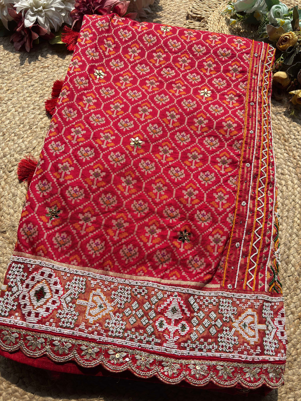 Royal Red Patola-Inspired Designer Saree with Intricate Beadwork, Traditional Motifs and Scalloped Lace Border