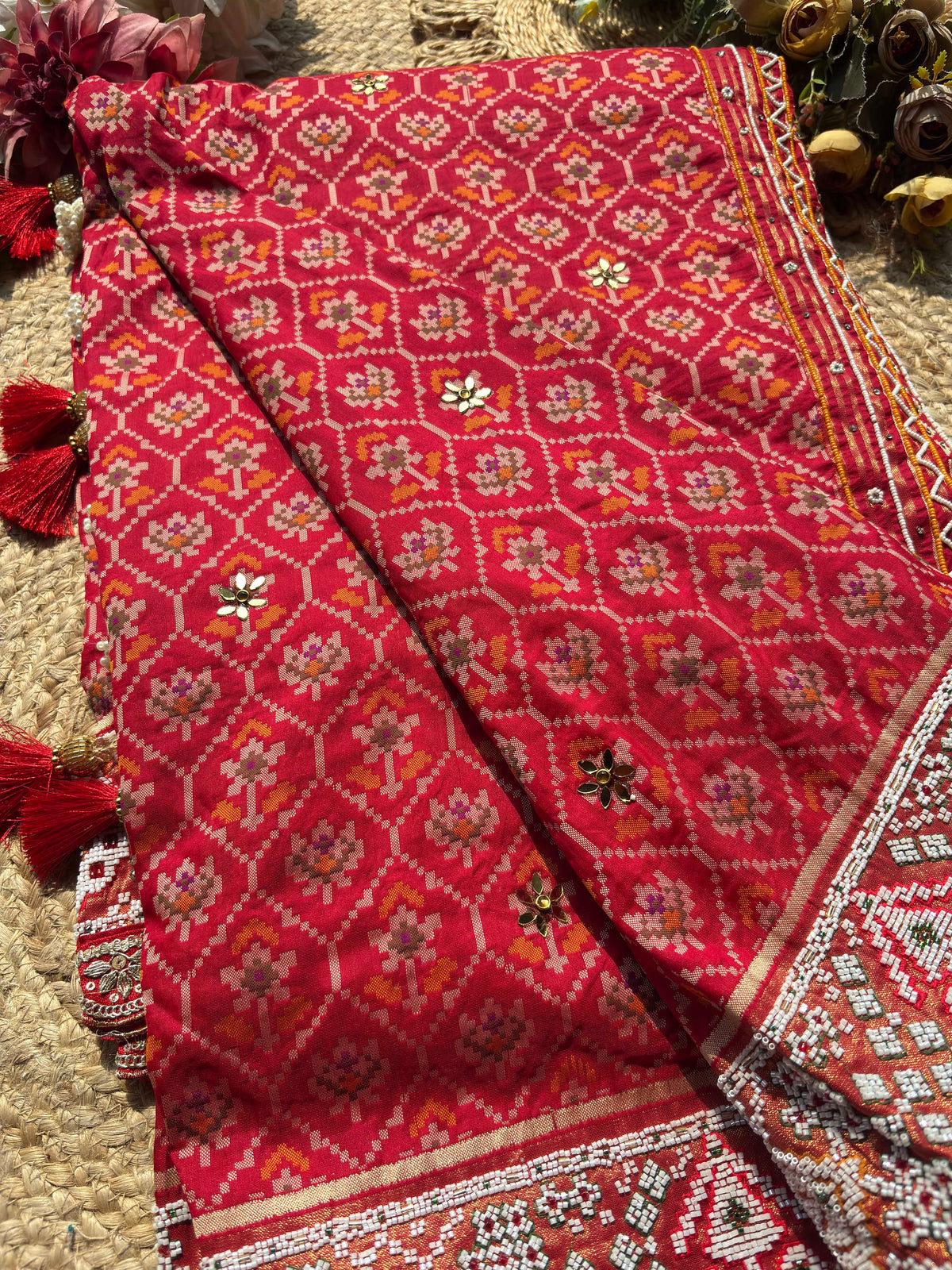 Royal Red Patola-Inspired Designer Saree with Intricate Beadwork, Traditional Motifs and Scalloped Lace Border