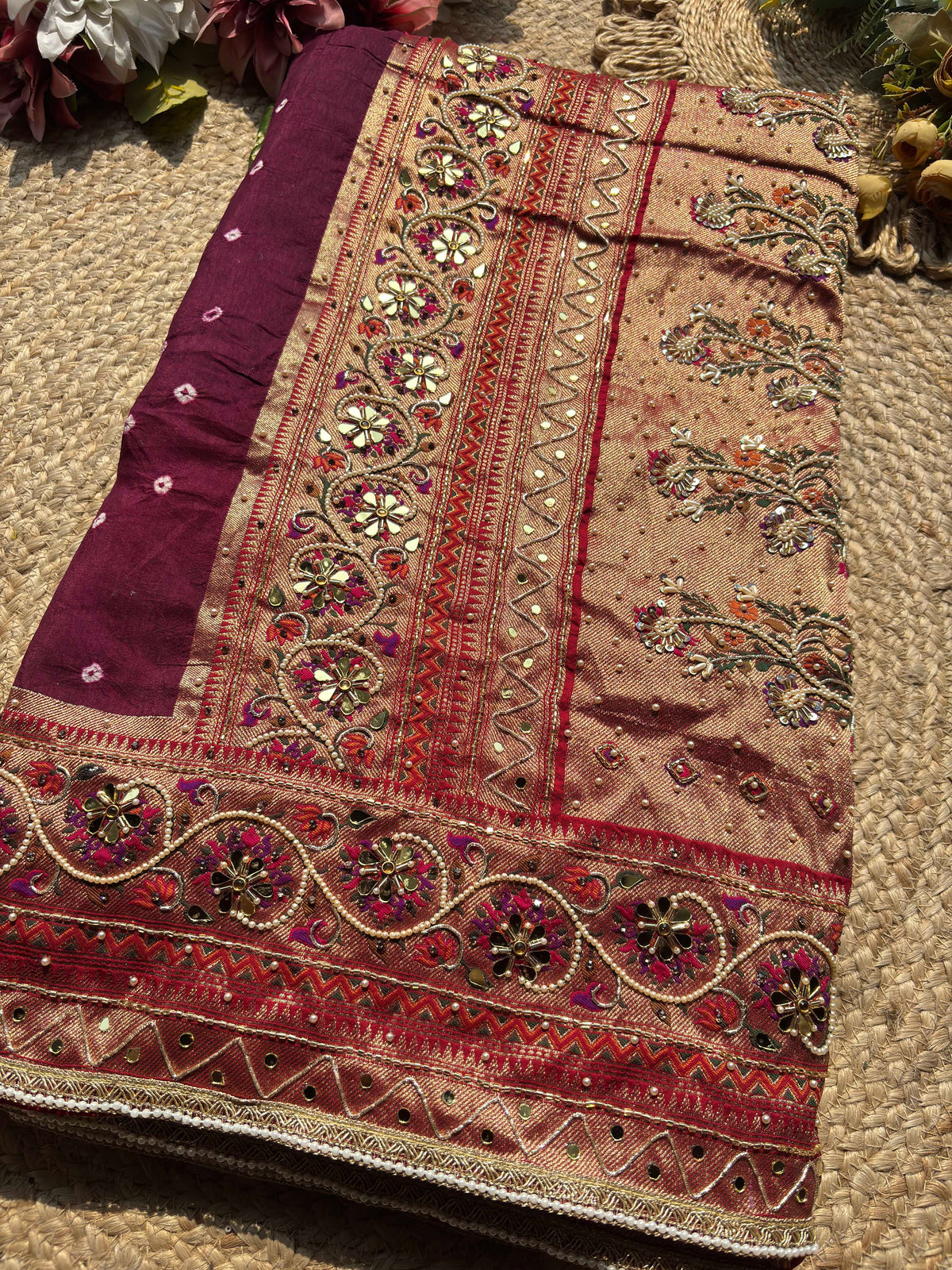 Royal Wine Maroon Designer Saree with Rich Golden Zari Border, Floral Mirror Work, Pearl Beadwork and Traditional Embroidery