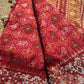 Royal Red Patola-Inspired Designer Saree with Golden Zari-Style Border, Multicolour Floral Motifs, Intricate White Beadwork and Pearl Tassel Detailing