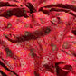 Royal Red Patola-Inspired Designer Saree with Golden Zari-Style Border, Multicolour Floral Motifs, Intricate White Beadwork and Pearl Tassel Detailing