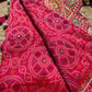 Rani Pink Bandhani Designer Saree with Traditional Elephant Motifs, Intricate Pearl Beadwork, Mirror Embellishments, Gold Zari Detailing and Scalloped Lace Border