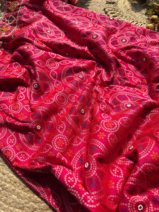 Rani Pink Bandhani Designer Saree with Traditional Elephant Motifs, Intricate Pearl Beadwork, Mirror Embellishments, Gold Zari Detailing and Scalloped Lace Border