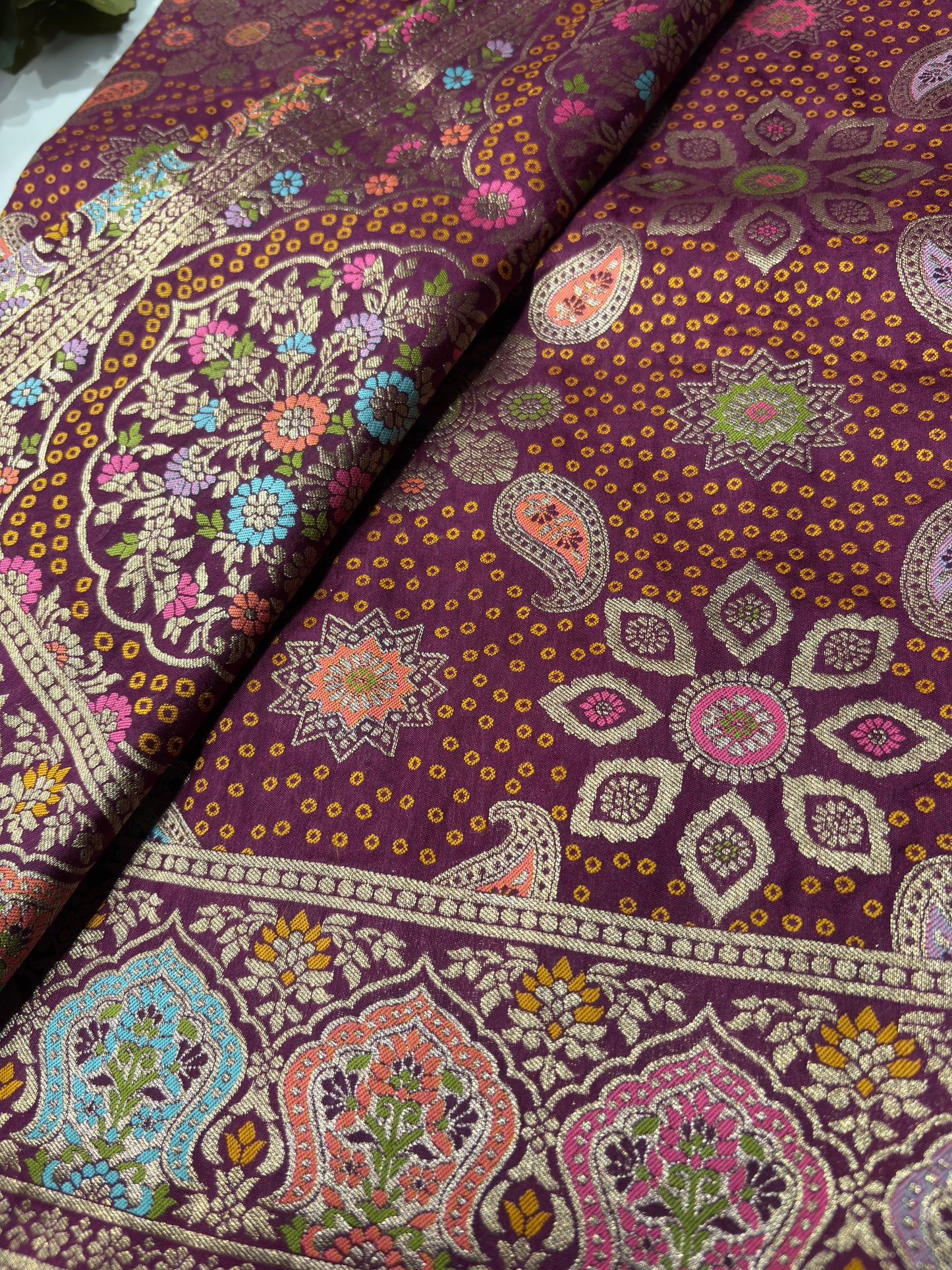Wine Designer Woven Saree with Floral Paisley Motifs & Rich Border
