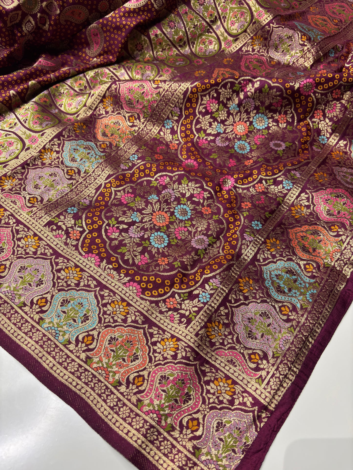 Wine Designer Woven Saree with Floral Paisley Motifs & Rich Border