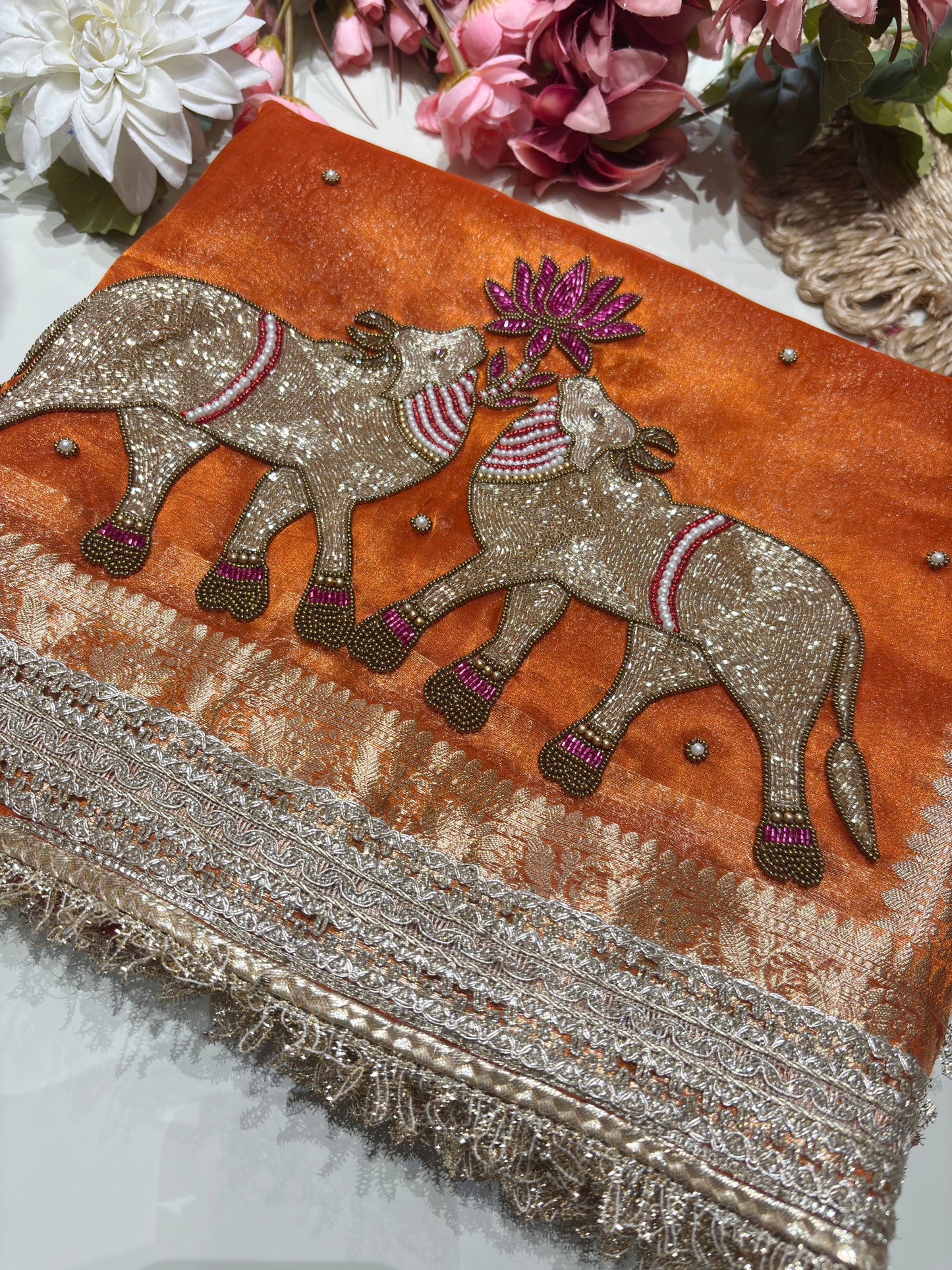 Orange Designer Saree with Elephant Embroidery & Rich Zari Border