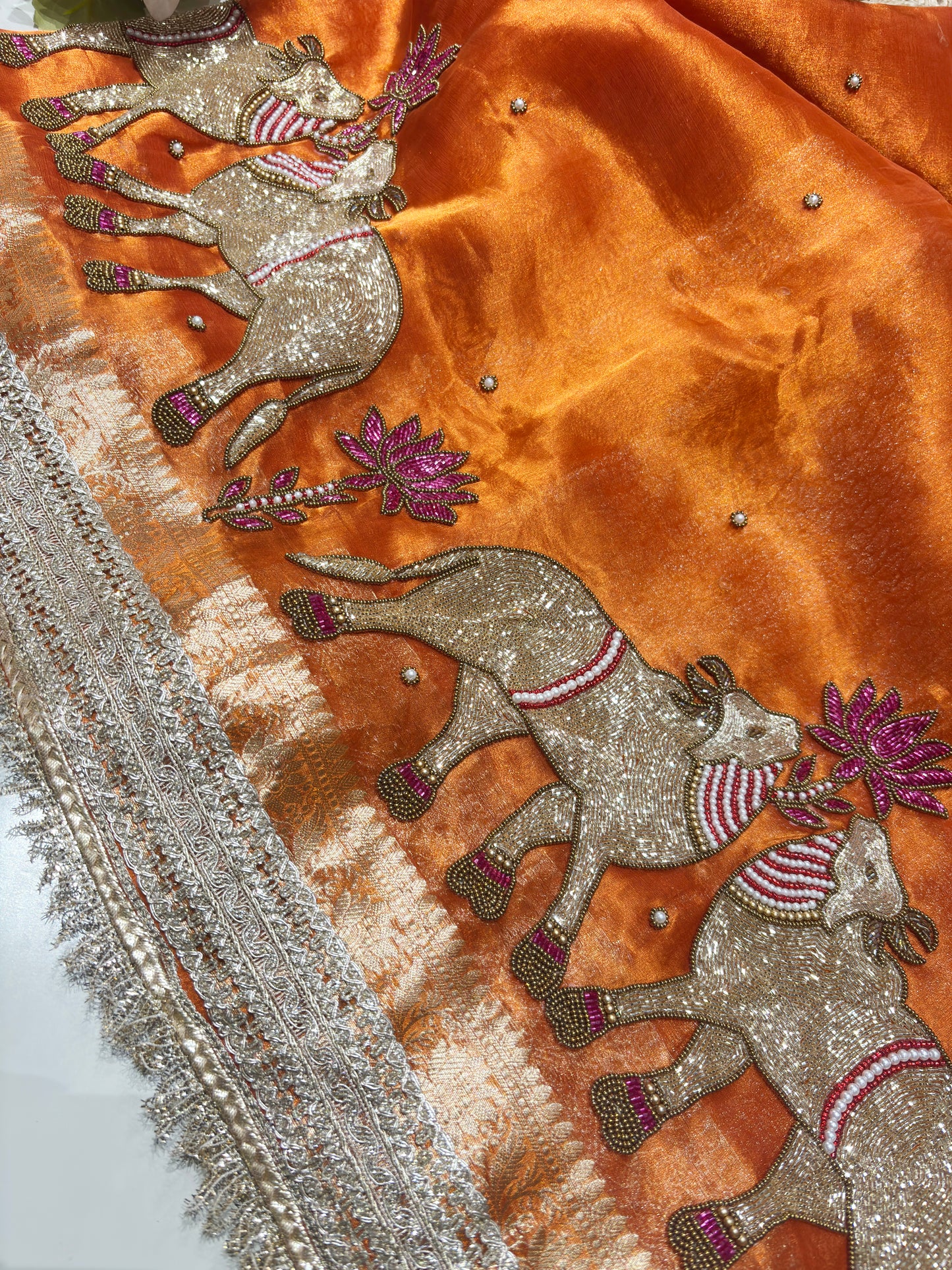 Orange Designer Saree with Elephant Embroidery & Rich Zari Border
