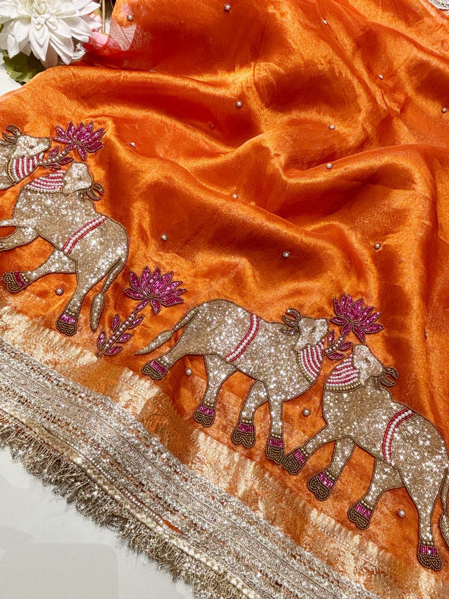 Orange Designer Saree with Elephant Embroidery & Rich Zari Border