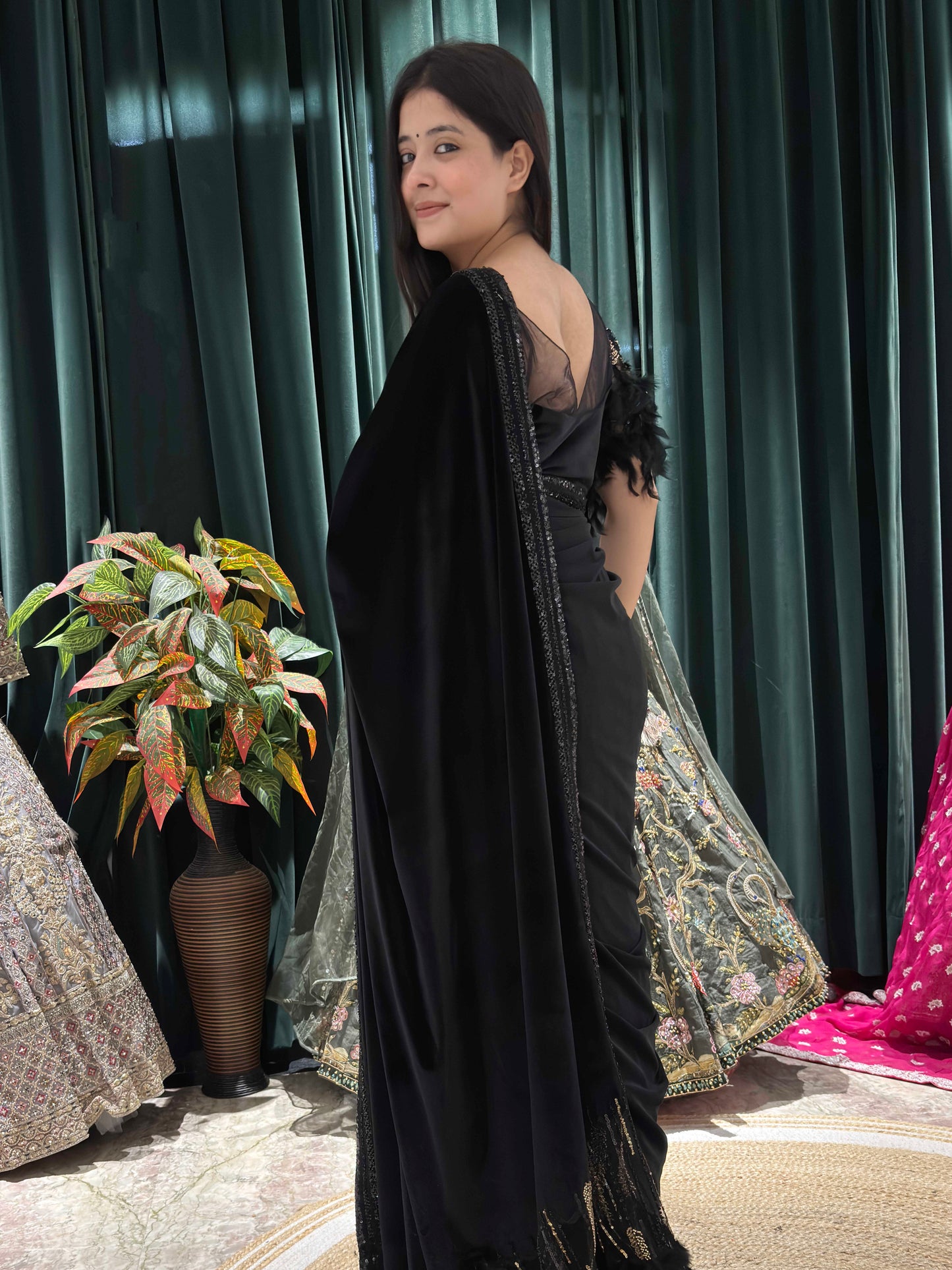 Elegance Saree With Feather Accents And Sequin Embellishments