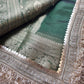 Emerald Green Ladoo Gopal Embroidered Saree with Ornate Gold Border