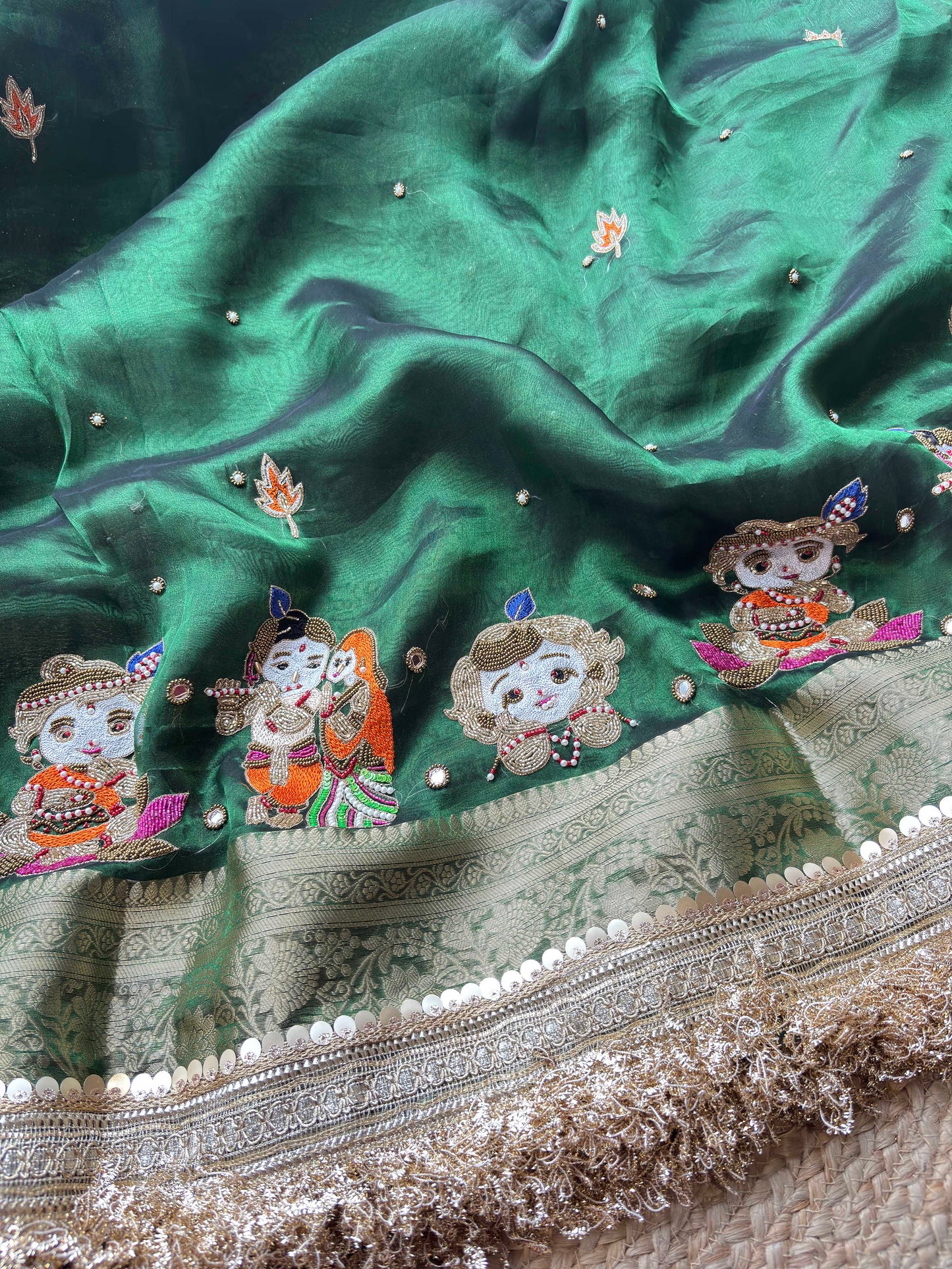 Emerald Green Ladoo Gopal Embroidered Saree with Ornate Gold Border