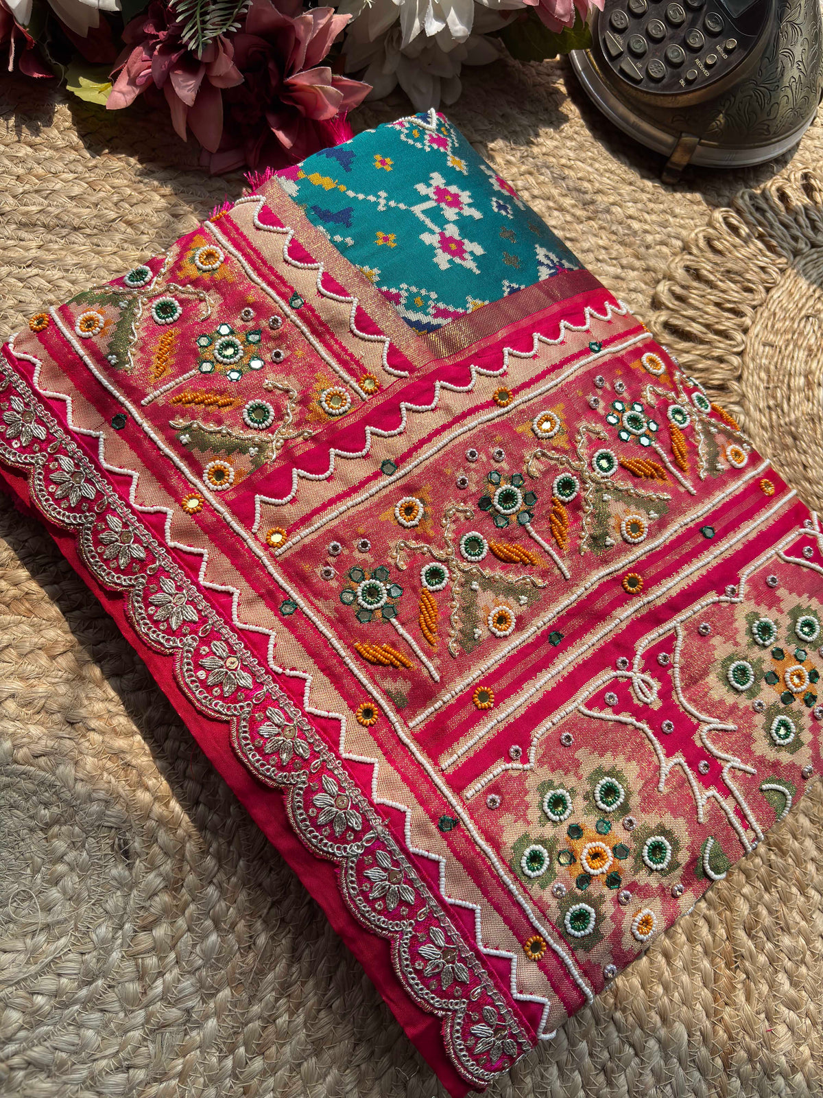 Turquoise Patola Saree with Pink Embellished Floral Border