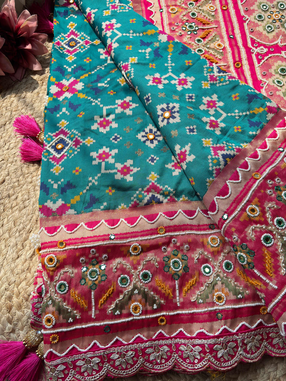 Turquoise Patola Saree with Pink Embellished Floral Border