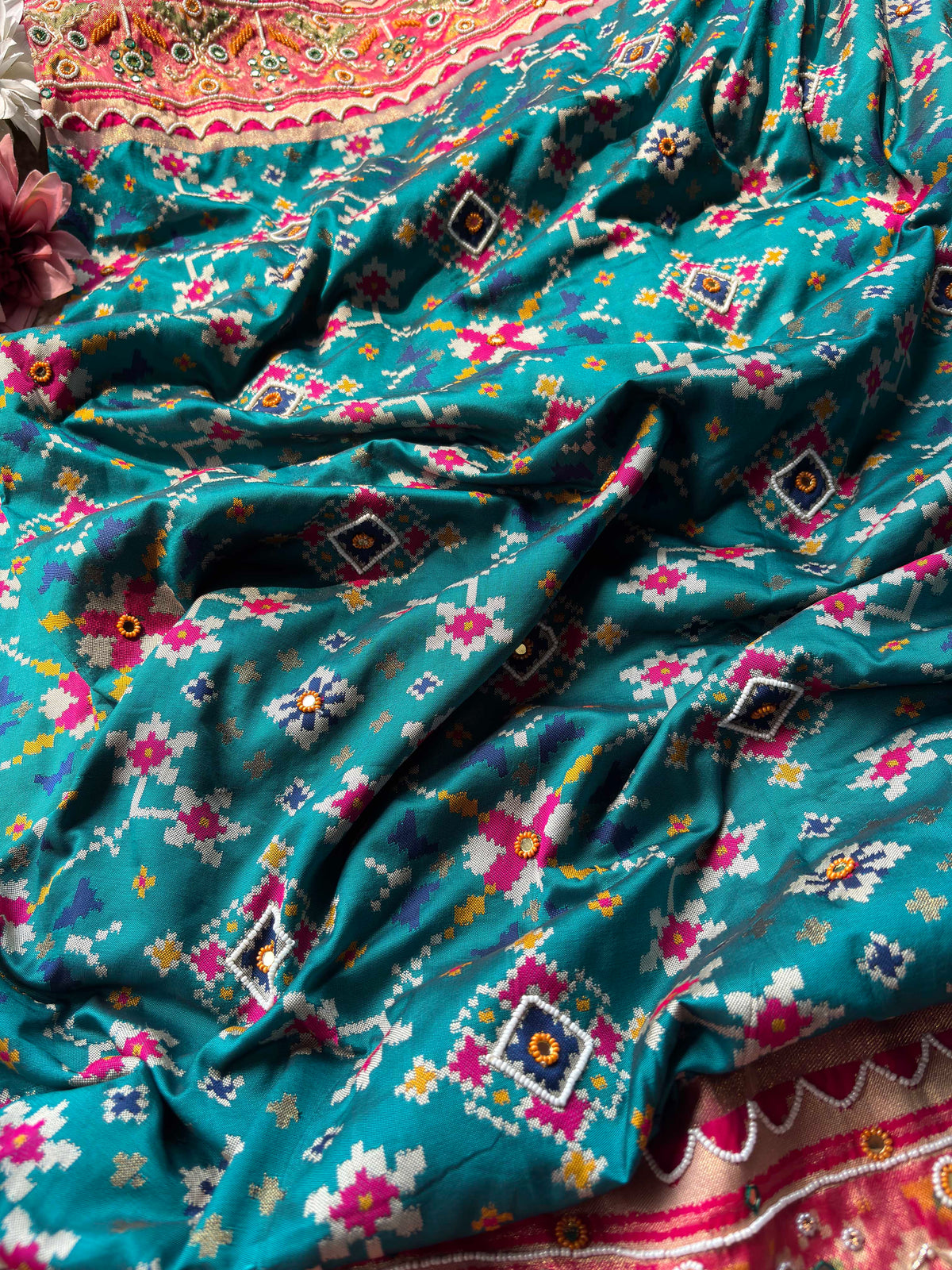 Turquoise Patola Saree with Pink Embellished Floral Border