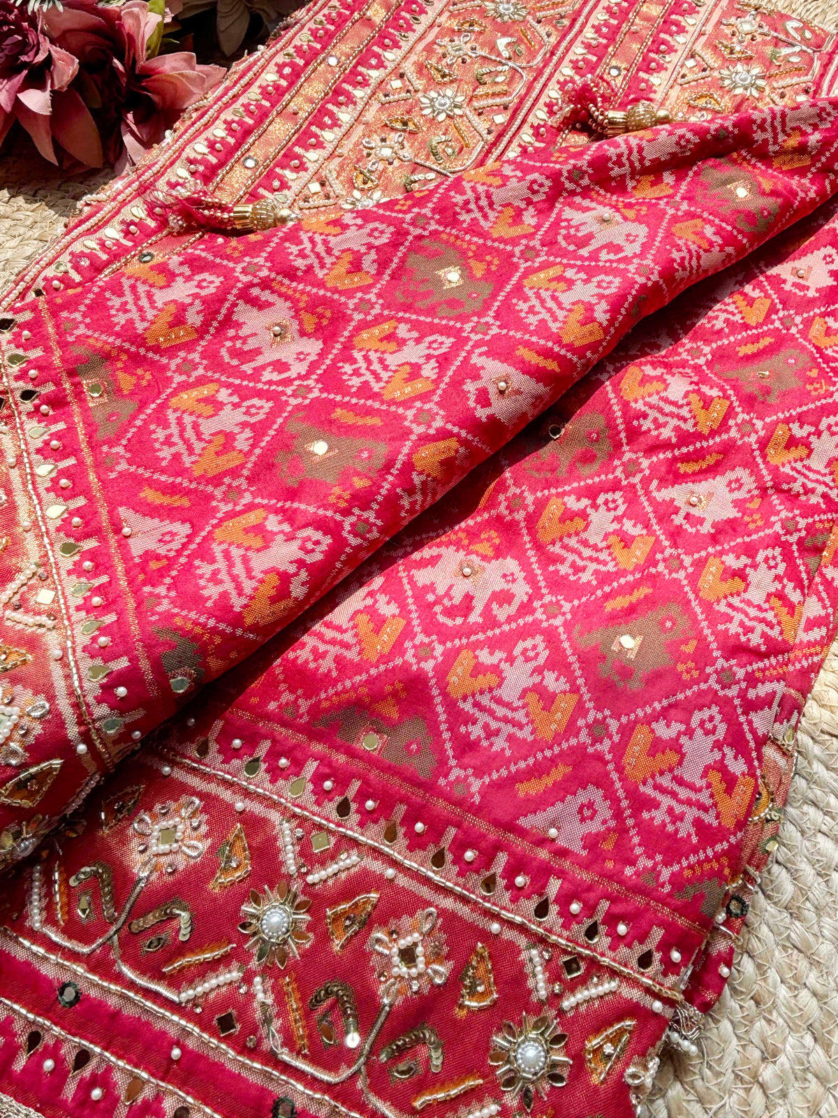Rani Pink Patola Saree with Elephant Motifs & Embellished Border