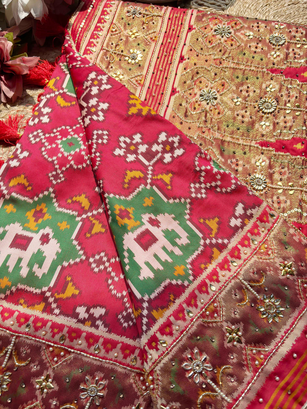 Rani Pink Patola Saree with Elephant Motifs & Embellished Border