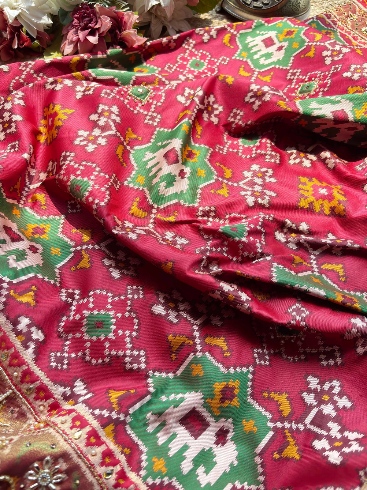Rani Pink Patola Saree with Elephant Motifs & Embellished Border