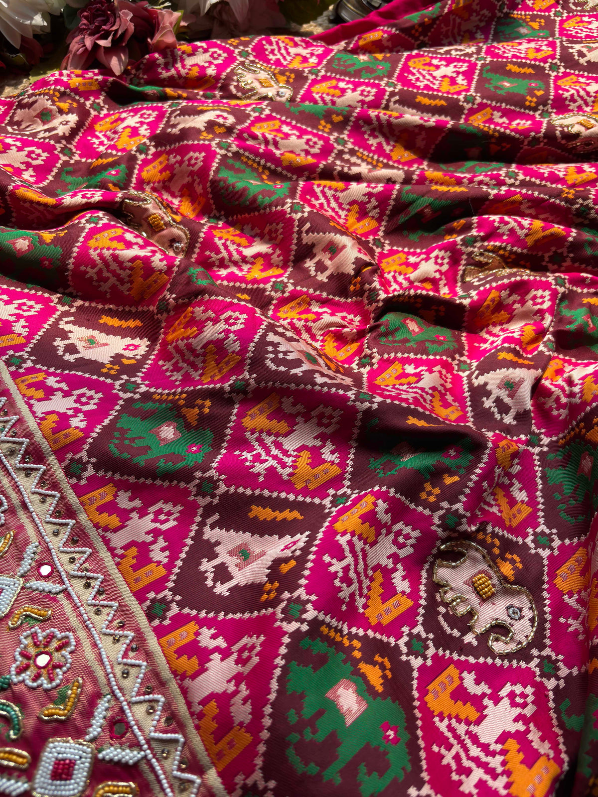 Rani Pink Patola Saree with Elephant Motifs & Beaded Border