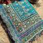 Teal Patola Saree with Floral Motifs & Embellished Border