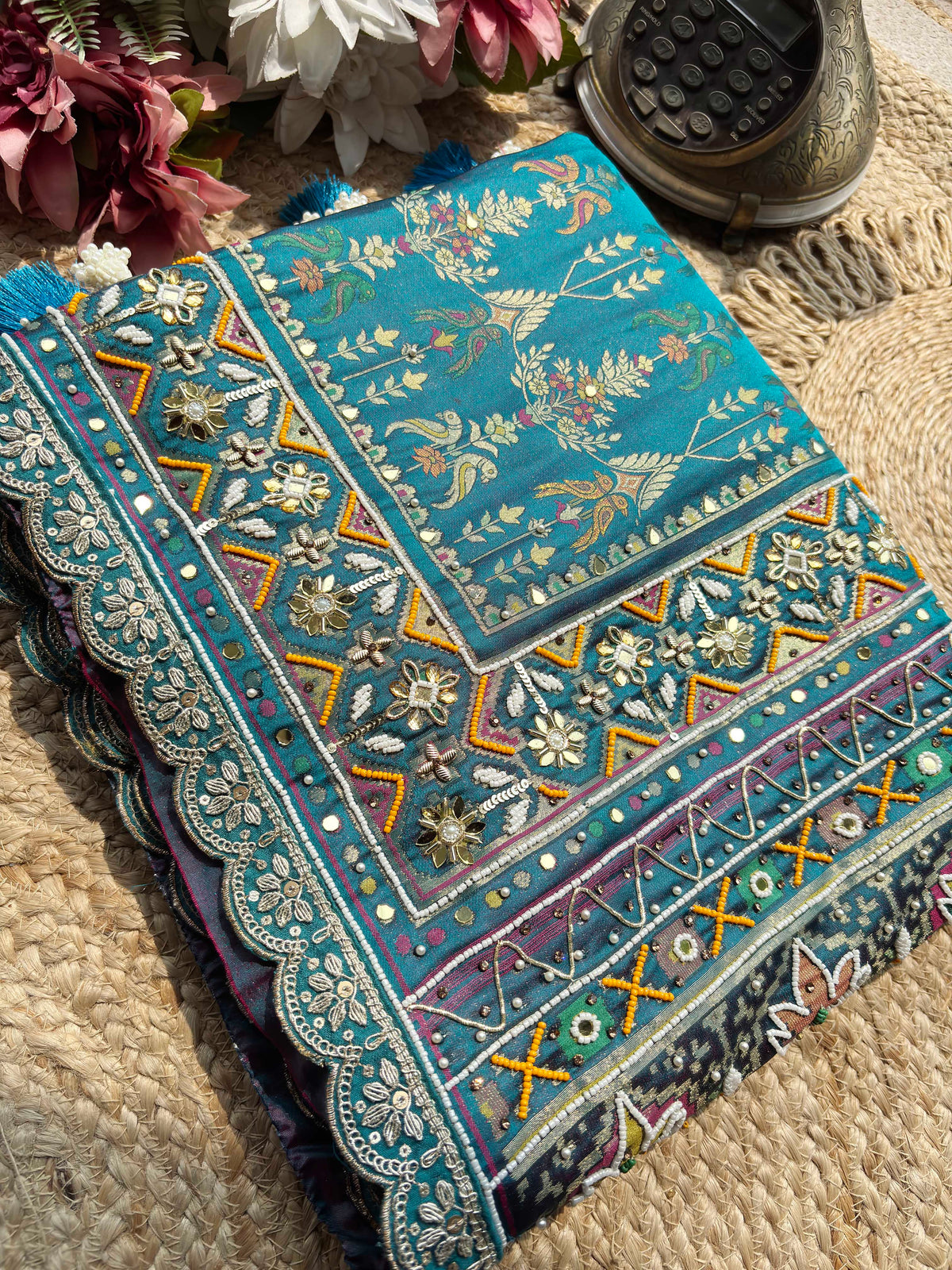 Teal Patola Saree with Floral Motifs & Embellished Border