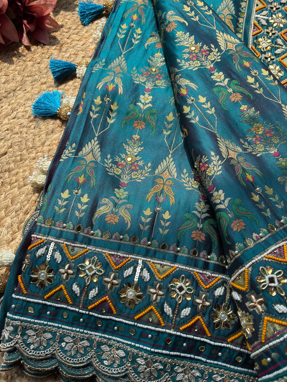 Teal Patola Saree with Floral Motifs & Embellished Border
