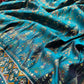Teal Patola Saree with Floral Motifs & Embellished Border