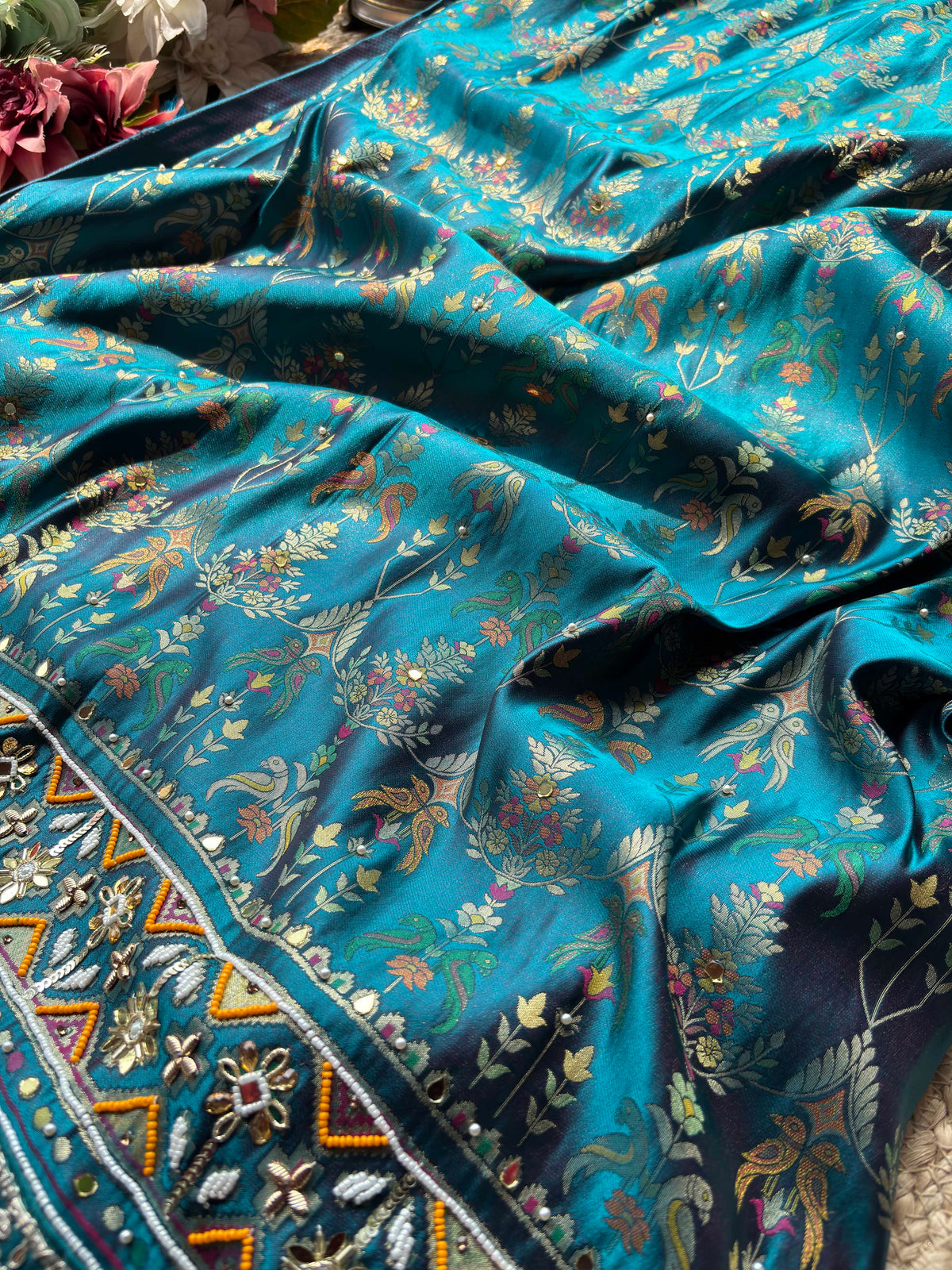 Teal Patola Saree with Floral Motifs & Embellished Border