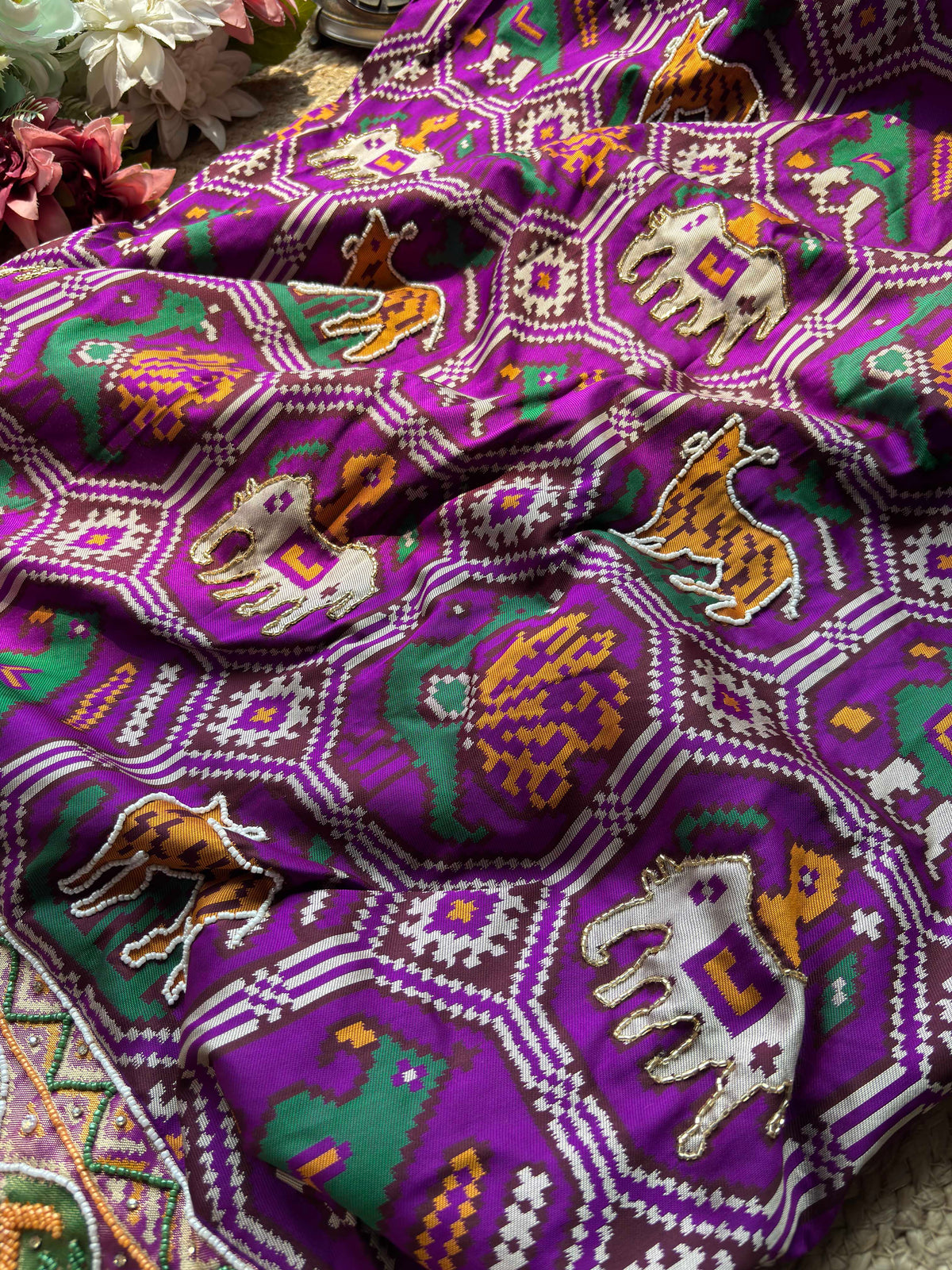 Purple Patola Saree with Tiger Motifs & Beaded Border