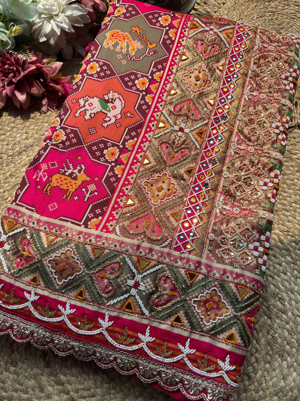 Rani Pink Patola Saree with Animal Motifs & Embellished Border