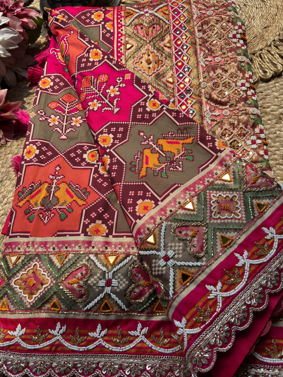 Rani Pink Patola Saree with Animal Motifs & Embellished Border