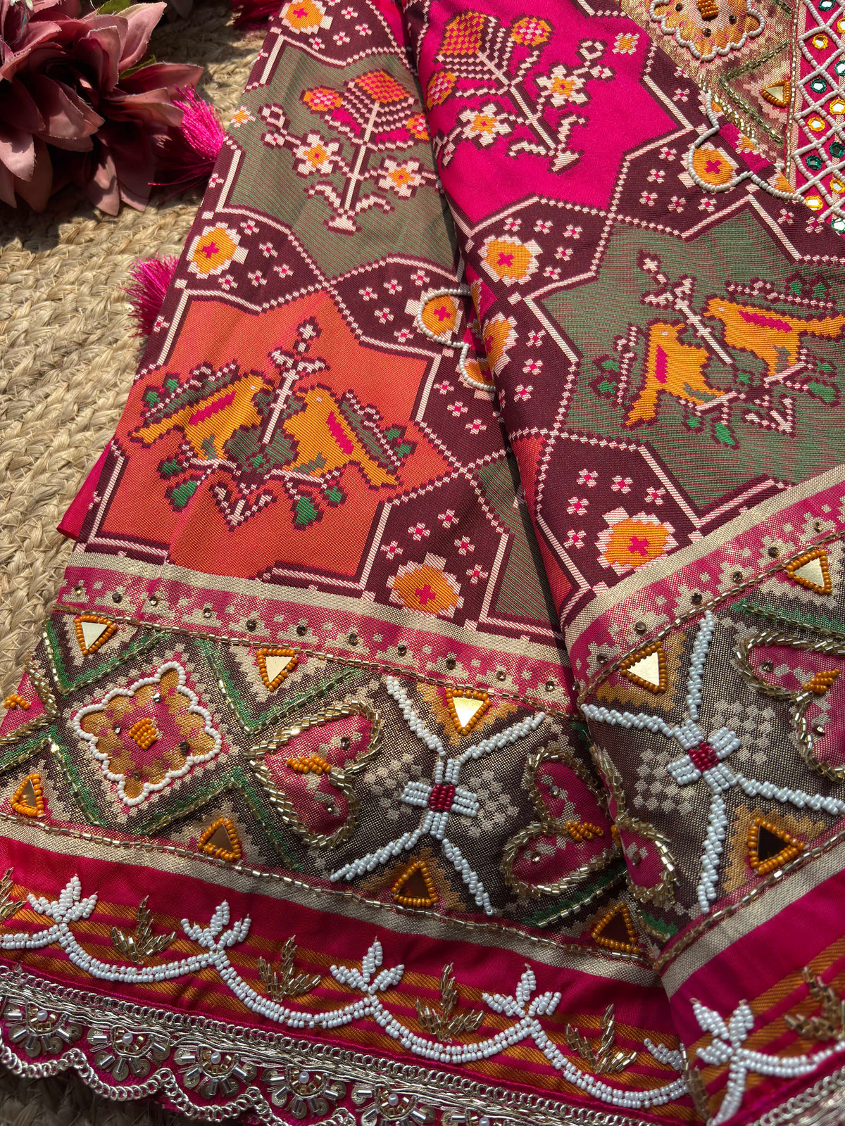 Rani Pink Patola Saree with Animal Motifs & Embellished Border