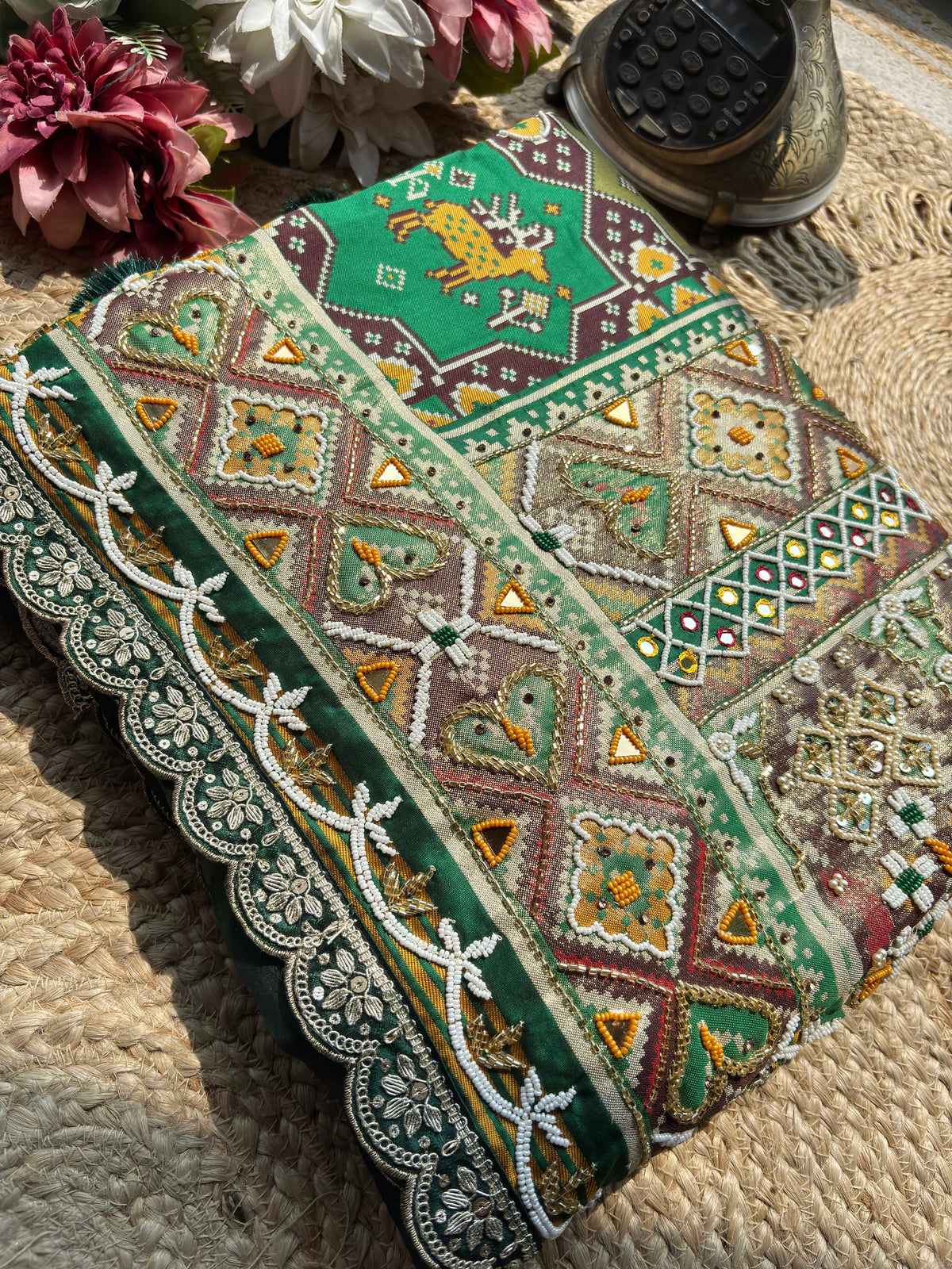 Green Patola Saree with Animal Motifs & Embellished Border