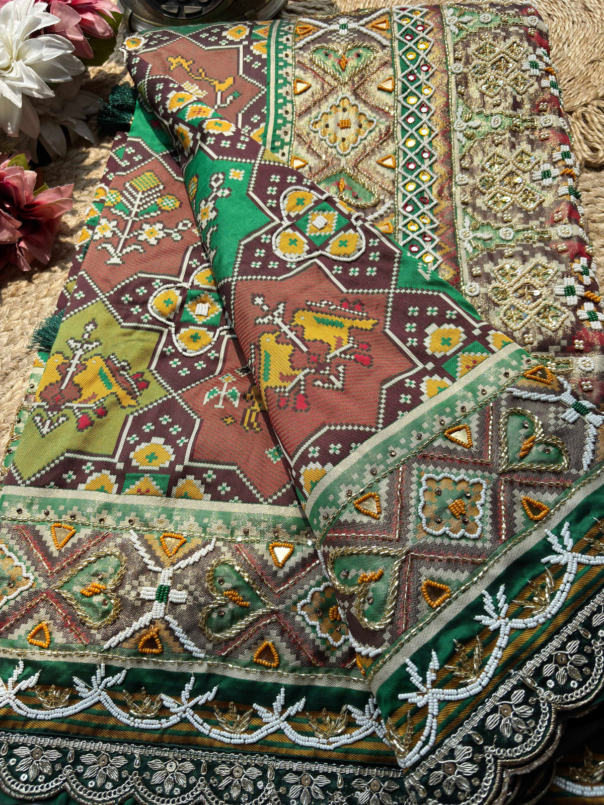 Green Patola Saree with Animal Motifs & Embellished Border